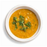 Yellow Lentil Daal · We use three types of lentils and slow cook them with veggies, herbs, and spices to create a...