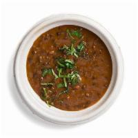 Black Lentil Daal · Black lentils, tomatoes, and spices are simmered to a deep, rich and creamy finish. It's yum...