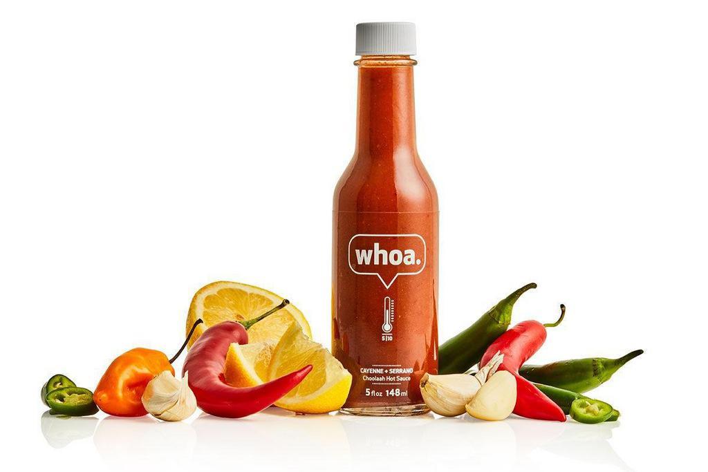 Whoa Hot Sauce Bottle  · It's a gluten-friendly combo of tart and sweet that will put a smile on anyone's face. Heat Level: 5/10 (VE, GF). 5 fl oz.