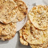 Naan Bread · Try our soft and crispy vegetarian-friendly naan or the flaky vegan wheat naan. Includes 4 f...
