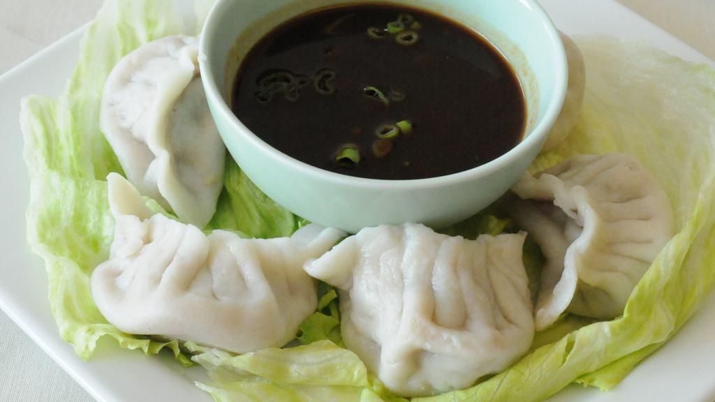 Steamed Dumplings (6 Pcs.) · Filled with pork, celery, scallions, napa and ginger. Served with dumpling sauce.
