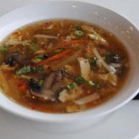 Hot & Sour Soup · Tofu, celery, carrots, scallions, bamboo shoots, water chestnuts, mushrooms and egg in hot a...