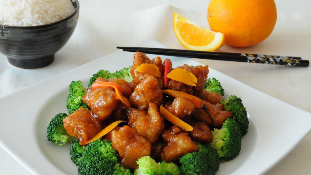 Orange Chicken (Spicy) · Lightly breaded crispy chicken stir-fried in a fragrant orange flavored-chili sauce served with broccoli. Hot and spicy.