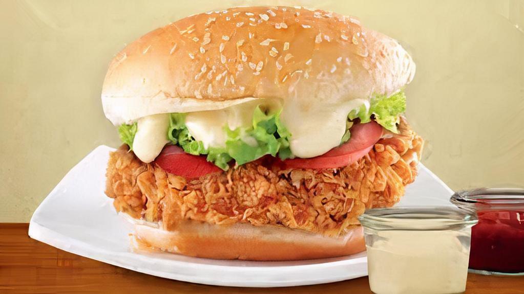 Fried Chicken Burger · Our spin on a traditional fried chicken sandwich consists of deep fried chicken patty along with Lettuce and onions