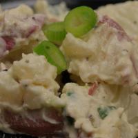 Bacon Tater Salad · Our smoked potatoes smothered in a cool mayo cream dressing and a hint of bacon.