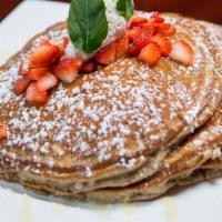 Chocolate Abuelita Pancakes · Mexican chocolate pancakes. Served with Fresh strawberries homemade whipped cream and powder...