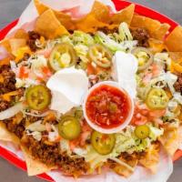 Nachos Supreme · Choice of steak (for an additional charge), chicken, beef or chili - lettuce + tomatoes + so...
