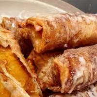 Strawberry Crunch Egg Roll · 3 Fried egg rolls filled with homemade cheesecake mix, strawberries, cheesecake bites, straw...