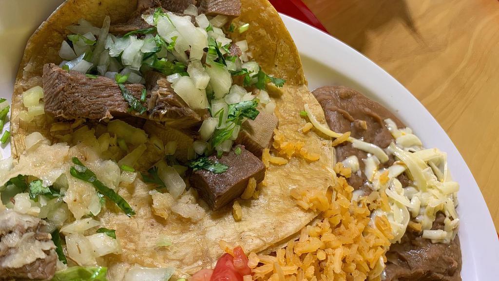 Lengua Taco · Comes with cilantro and onions. Please use the modifiers to add extra toppings.