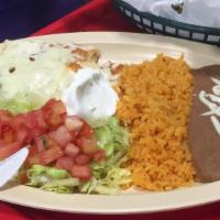 Enchilada Platillo · Comes with your choice of meat, served with rice, beans, lettuce, tomatoes, sour cream, and ...
