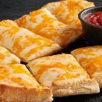 Four Cheese Garlic Bread · A 9” Italian loaf covered with our housemade creamy Parmesan garlic butter sauce then topped...