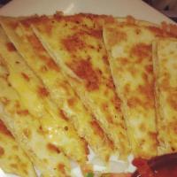 Chicken Quesadilla · Flour tortilla grilled with seasoned chicken, homemade salsa and cheddar jack cheese. Served...