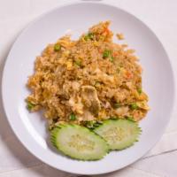 Kow Pad · Thai style fried rice with eggs, onions, peas, and carrots.