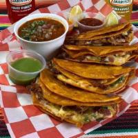 Birria Tacos · 4 birria tacos with corn tortillas, onion, cheese & side of consome