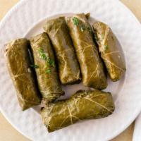Grape Leaves (Vegetarian) · Six pieces of rolled grape leaves, stuffed with rice and vegetables. Cooked with olive oil a...