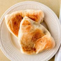 Authentic Spinach Pie · Two pieces of homemade dough baked, stuffed with fresh organic spinach, onion, lemon juice a...