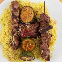 Beef Kabob · Two skewers of charbroiled tenderloin served with grilled vegetables.
