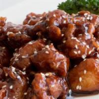 Orange Chicken · Breaded chicken in an exquisite sauce with orange rinds and red chili peppers