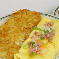 Western Omelette · A pile of ham with a blend of shredded cheese, diced onions, and green peppers.
