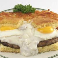 Corn Bread Benedict · Fresh baked cornbread topped with 2 sausage patties, and two eggs. Smothered with sausage gr...