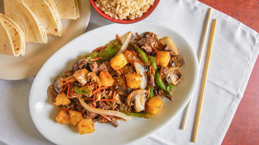 Teriyaki Bowl · Most Popular. Steak or chicken, onions, carrots, mushrooms, green peppers and pineapple with teriyaki sauce. Comes with choice of white or brown rice and tortillas.