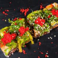 Momo Roll · Salmon, tuna, yellowtail, topped with eel, avocado, seaweed salad, and red tobiko.


Consumi...