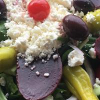 Greek    · Salad mixed with feta cheese topped with olives, beets tuscan peppers, red onions tossed in ...
