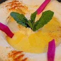 Hummus Classic Or Spicy   · Chickpeas puree with tahini sauce lemon juice & a hint of fresh garlic.