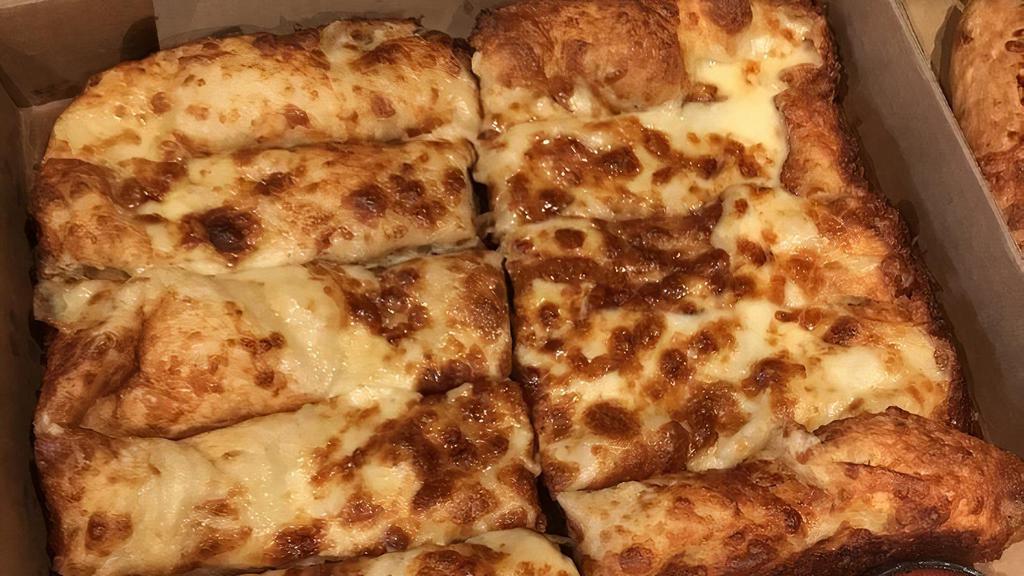 Garlic Cheese Bread · 12 slices served with 2 sides of pizza sauce.