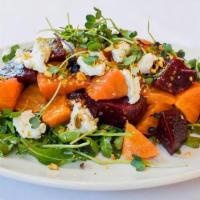 Beet Salad · marinated red & gold beets, goat cheese, pistachios, arugula, micro radish sprouts, champagn...