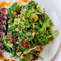 Seared Tuna Salad · sesame crusted yellowtail tuna, spinach, mixed greens, blistered tomatoes, cucumber, green o...