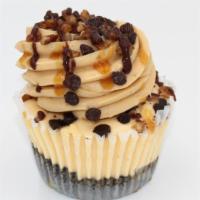 Turtle Cheesecake · Turtle cheesecake topped with caramel buttercream, sprinkled with pecans and chocolate chips...