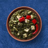 Spinach Cottage Cheese Showdown · Cottage cheese cooked in spinach curry with spices and onion, garlic and tomato. Served with...