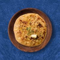 Classic Aloo Paratha · Pan-fried flat bread filled with peas, mashed potatoes and other vegetables