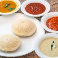 Plain Idli (2 Pieces) · Steamed rice cakes made with rice and lentils.