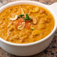 Cashew Tomato Masala · Roasted cashews cooked in a tomato, onion, & spices-based rich and creamy sauce.