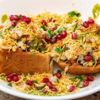 Dabeli · Spiced mashed potato mix with homemade chat masala, onions, peanuts, sev, & cilantro. Served...