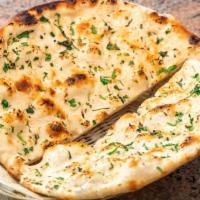 Garlic Naan · Flatbread made with white flour and garlic.