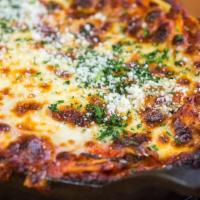 Lasagna · Layers of fresh pasta, veal, beef & pork tomato ragu, Ricotta, topped with mozzarella.