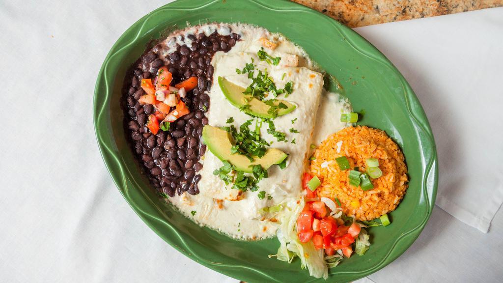 Cream Cheese Chicken Enchiladas · Grilled chicken & monterey jack cheese rolled inside two flour tortillas covered with white cream cheese sauce & sliced avocados. Served with black beans & rice.