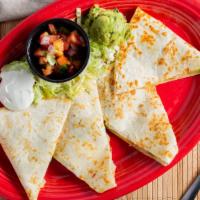 Shrimp Avocado Quesadilla · Grilled shrimp, Monterey jack cheese and avocado grilled in a fresh flour tortilla. Served w...