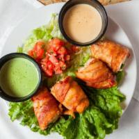 Cancun Shrimp (4) · Hickory smoked bacon wrapped shrimp stuffed with a jalapeño slice, pepper jack cheese, and g...