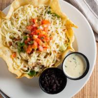 Yucatan Chicken Salad · Grilled chicken, lettuce, poblano rice, and Monterey jack cheese layered in a crispy flour t...