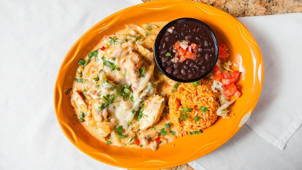 Pollo Poblano · Sliced grilled chicken breast, mushrooms, poblano peppers, onions and pico de gallo sautéed with chipotle cream sauce, served with black beans, rice, and tortillas.