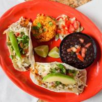 Fish Tacos Del Rio · Grilled tilapia, sauteed red, and green peppers, shredded cabbage, pico de gallo, Monterey j...