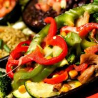 Veggie Fajita · Mushrooms, onions, broccoli, zucchini, corn, and bell peppers. Served with pico de gallo, gu...