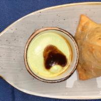 Street Style Delhi Samosas · Flour Dough Triangles Filled With Vegetable or Meat and Fried. Served with Mint & Tamarind Dip