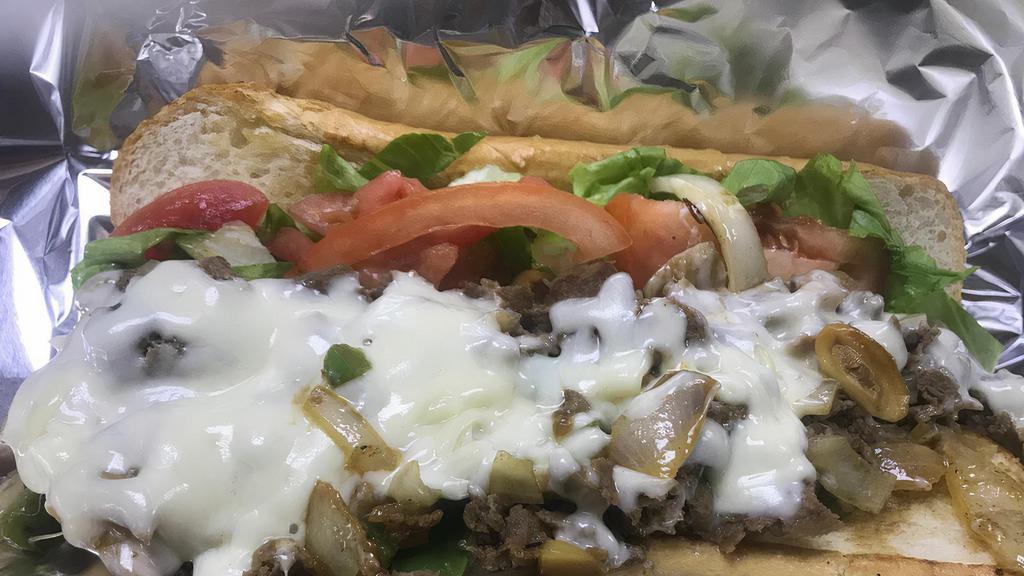 Philly Cheese Steak Sandwich · Lettuce, tomato, mayo, grilled onions, grilled bell peppers, mushrooms, and cheese.