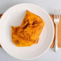 Jamaican Patties · Jamaica's version of the empanada. Soft, flaky dough filled with meat and spices.