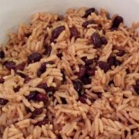 Coconut Rice And Beans · Red beans cooked in coconut milk with scallion, shredded coconut, and Island spices.